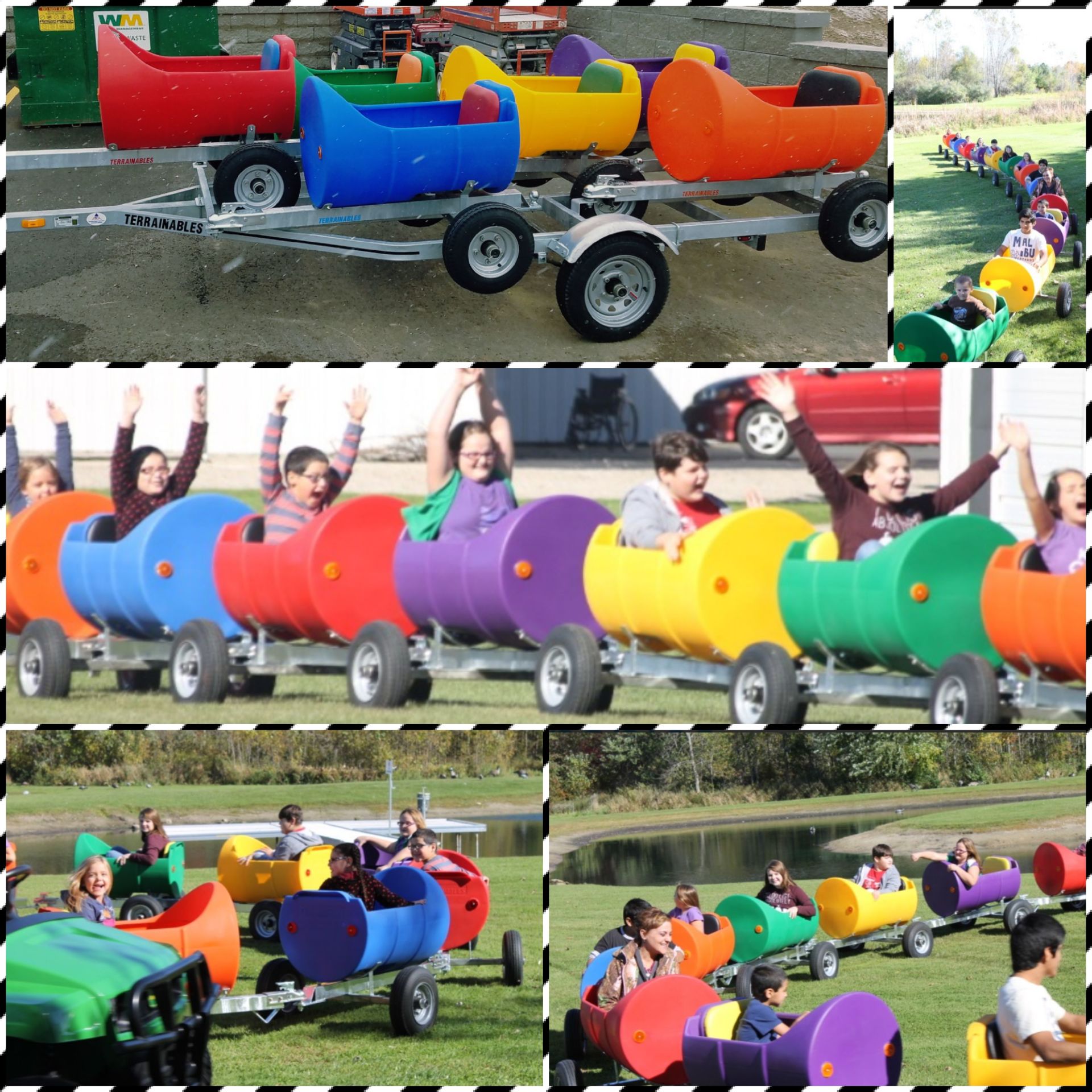 Colorful barrel-shaped pedal carts with riders on a grassy field, lined up in a race.