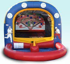 Blue inflatable carnival game with red base and colorful targets inside.