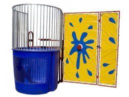 Birdcage with blue base beside a yellow floral foldable screen