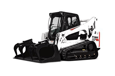 White Bobcat compact track loader with black attachment, isolated on white background