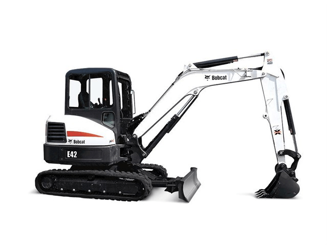 White and black Bobcat compact excavator with bucket, side view on white background