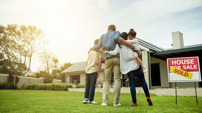 Shot Of A Family Of Four Viewing Their New Home Together - Raleigh, NC - A1 Pack Load & Moving