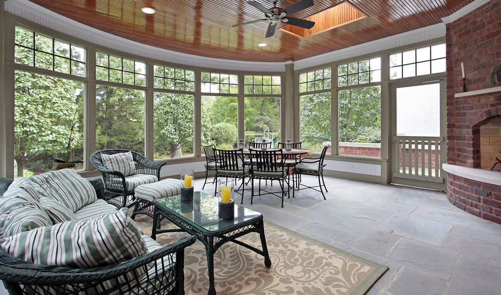 Sliding glass doors open to a patio, with text reading “Bring in Fresh Air...”