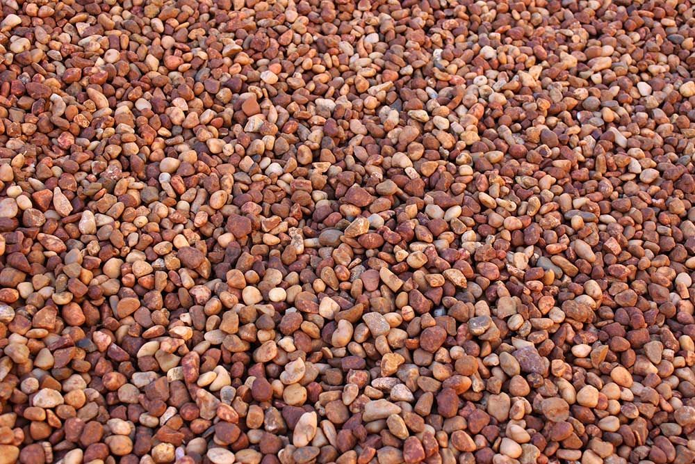 A Pile of Brown Gravel is Sitting on the Ground — Caloundra Landscape Supplies in Beerwah, QLD
