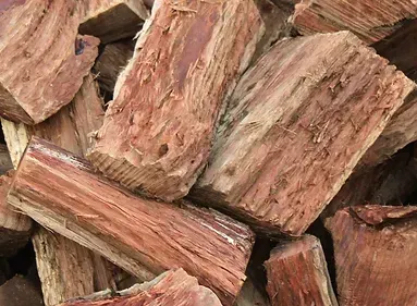A Pile of Chopped Wood is Sitting on Top of Each Other — Caloundra Landscape Supplies in Beerwah, QLD