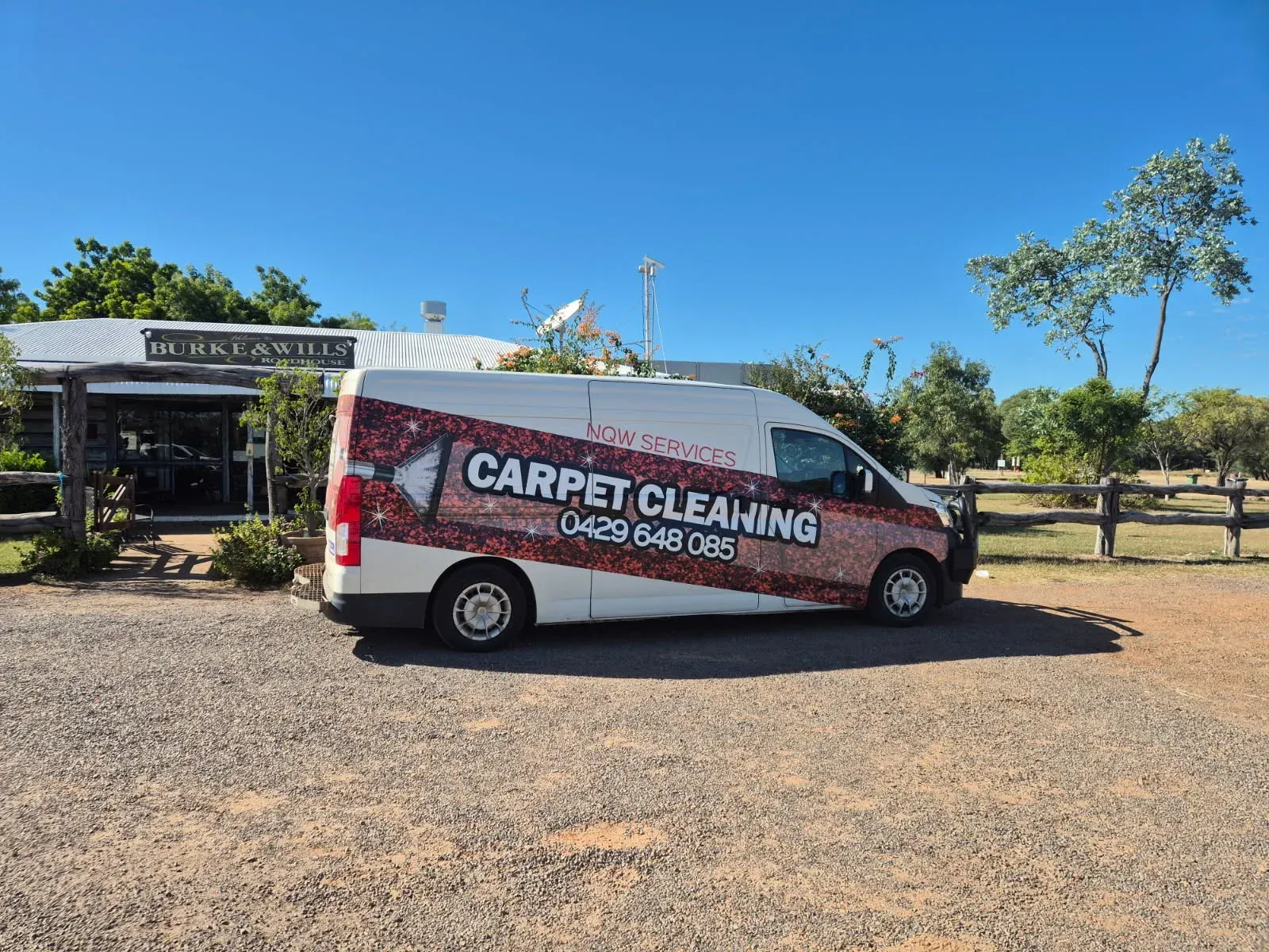 Carpet cleaning van parked on a gravel lot under a clear blue sky. — NQW Services In Tully, QLD