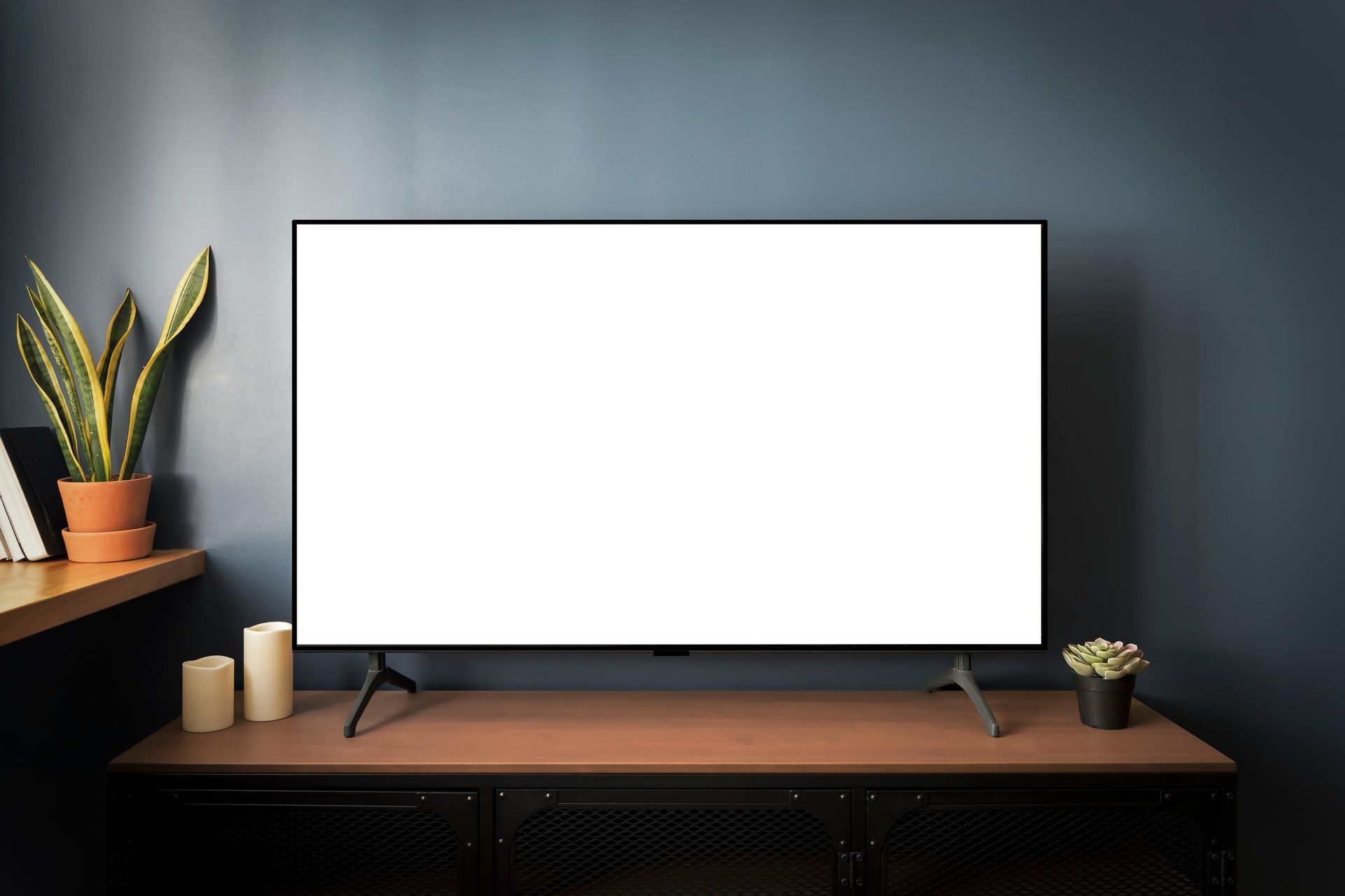 A flat screen tv with a white screen is sitting on a wooden table.