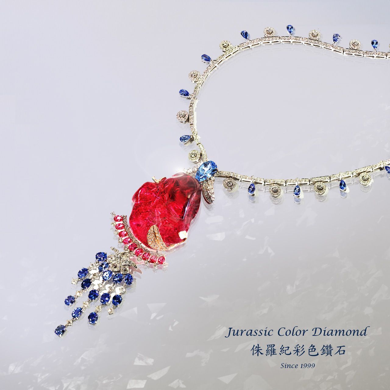 Jeweled necklace with red gemstone pendant and blue-and-white accents on a light background