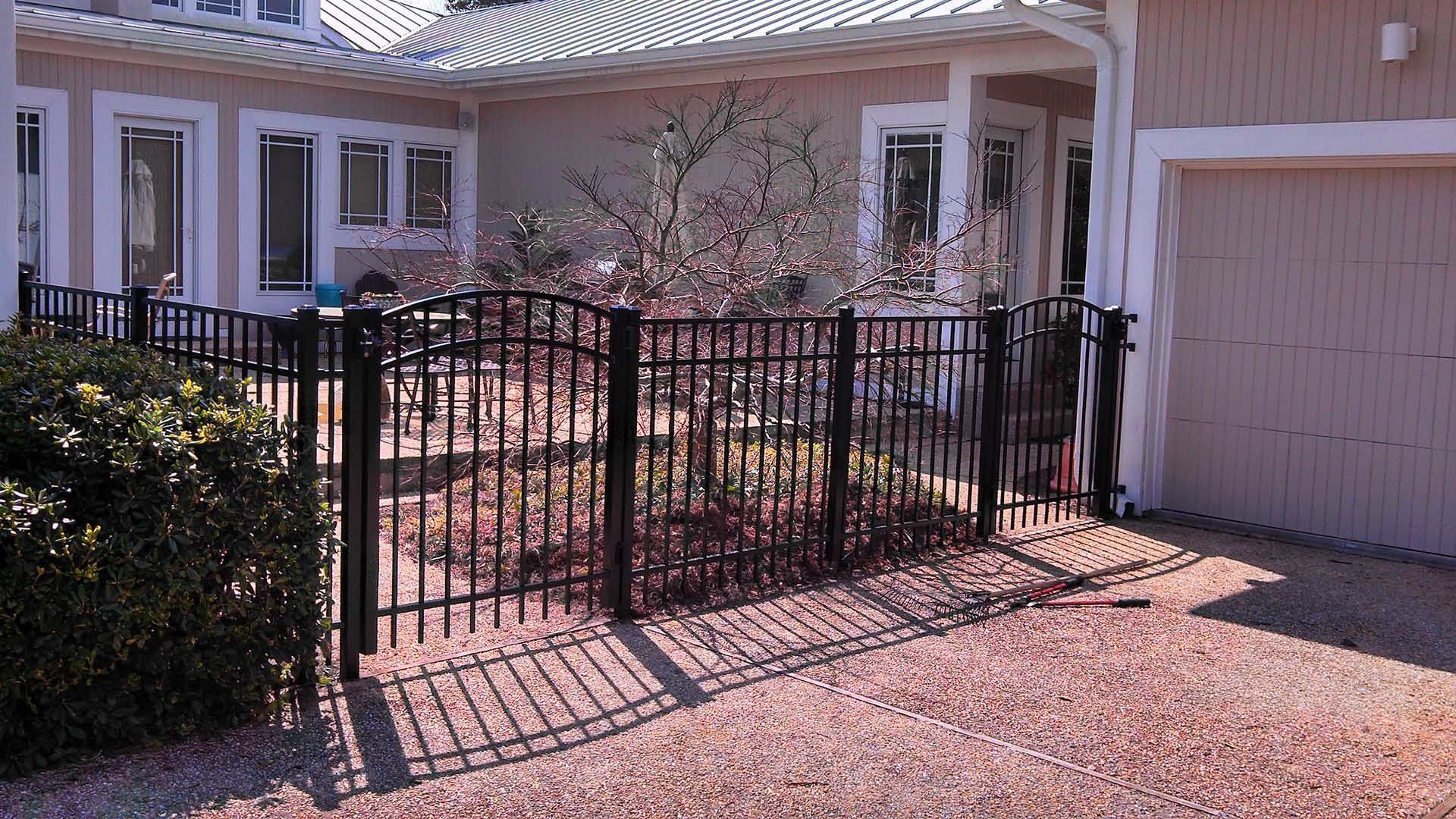 Black Fence With Gate — Wilmington, NC — J & J Fence Black Fence With Gate — Wilmington, NC — J & J Fence