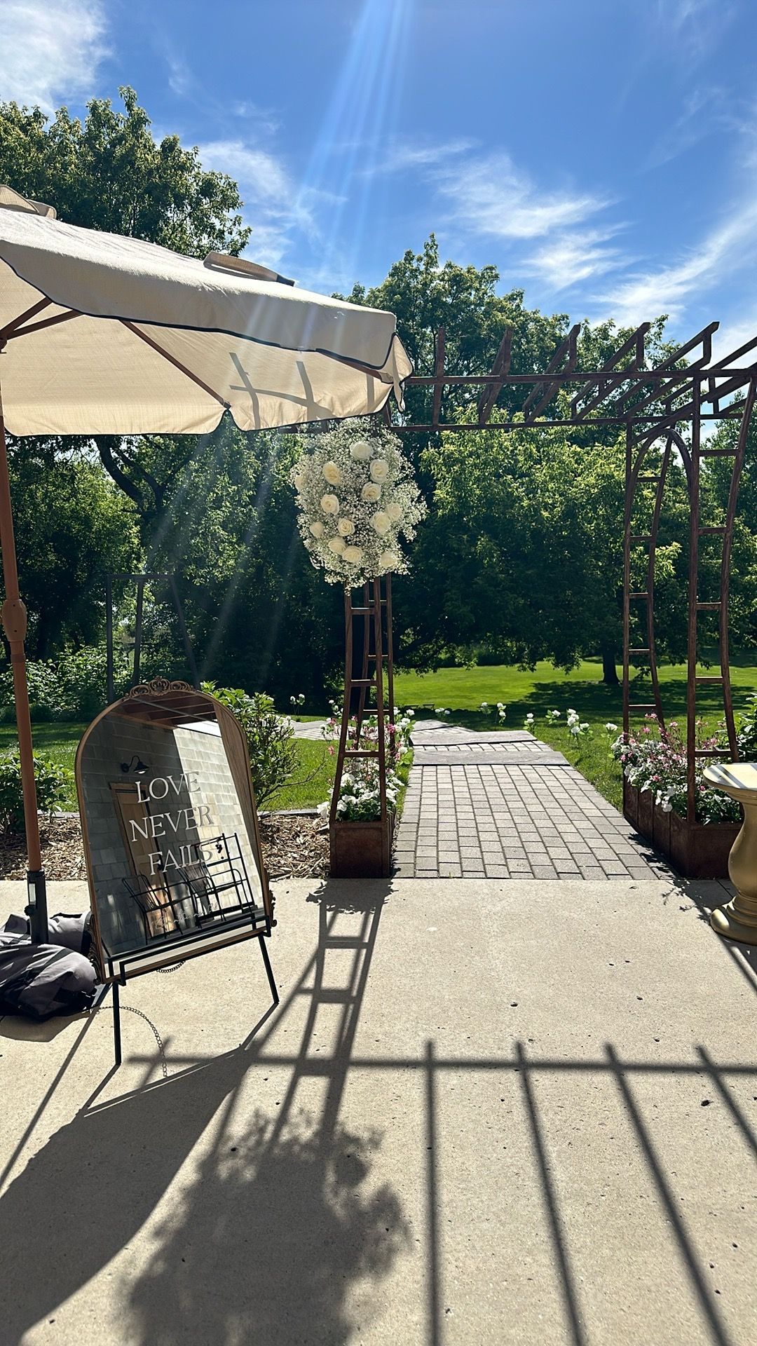 A large mirror on a stand with the words `` never fails '' written on it.