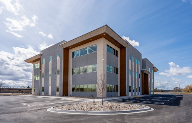 Ground view of three story Fluor Marine Propulsion building at an angle.