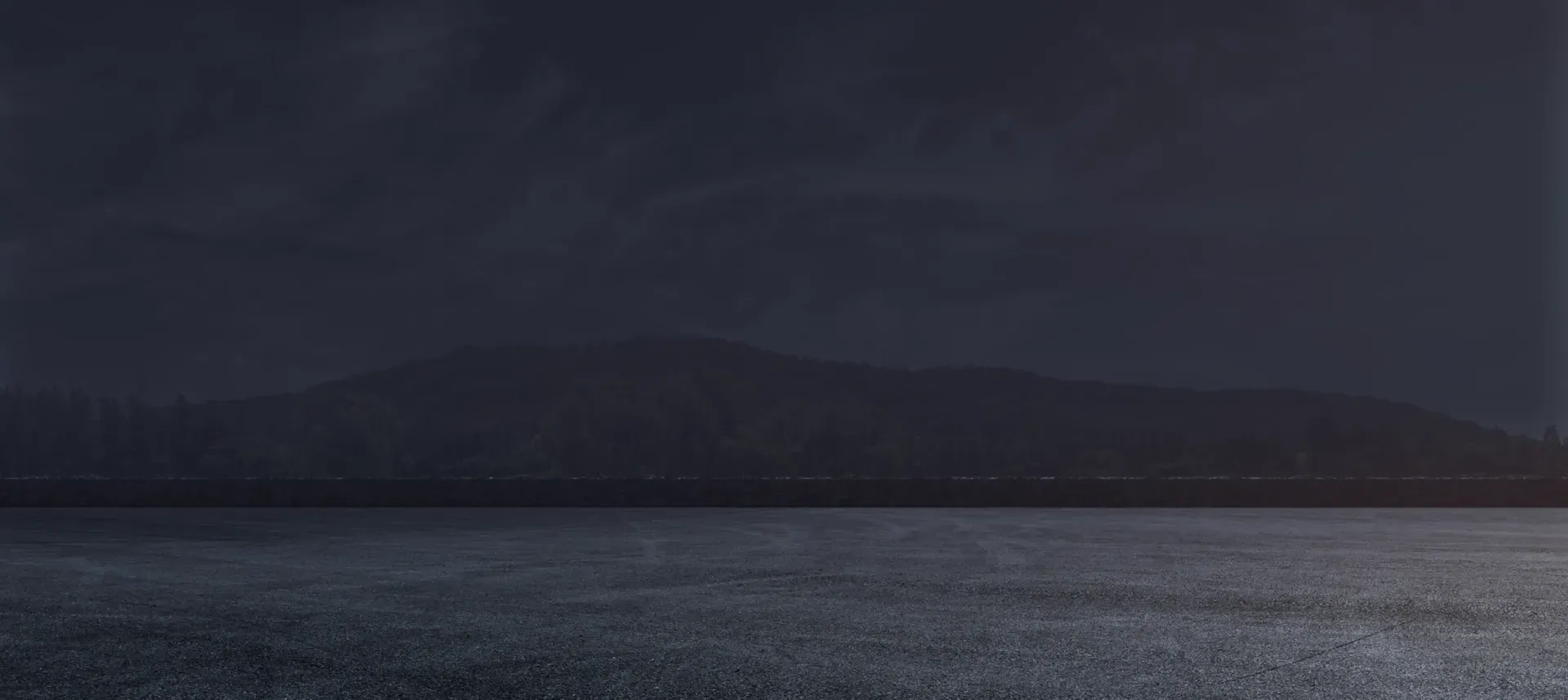 Dark background outside with scenery in background | Pro Auto Care