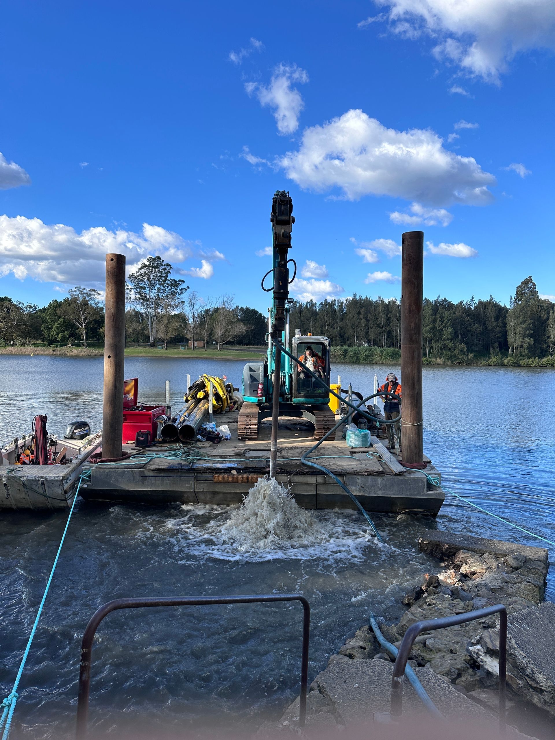 A Crane on A Floating Barge Operates in A River — M&J Marine Services in Lake Macquarie, NSW
