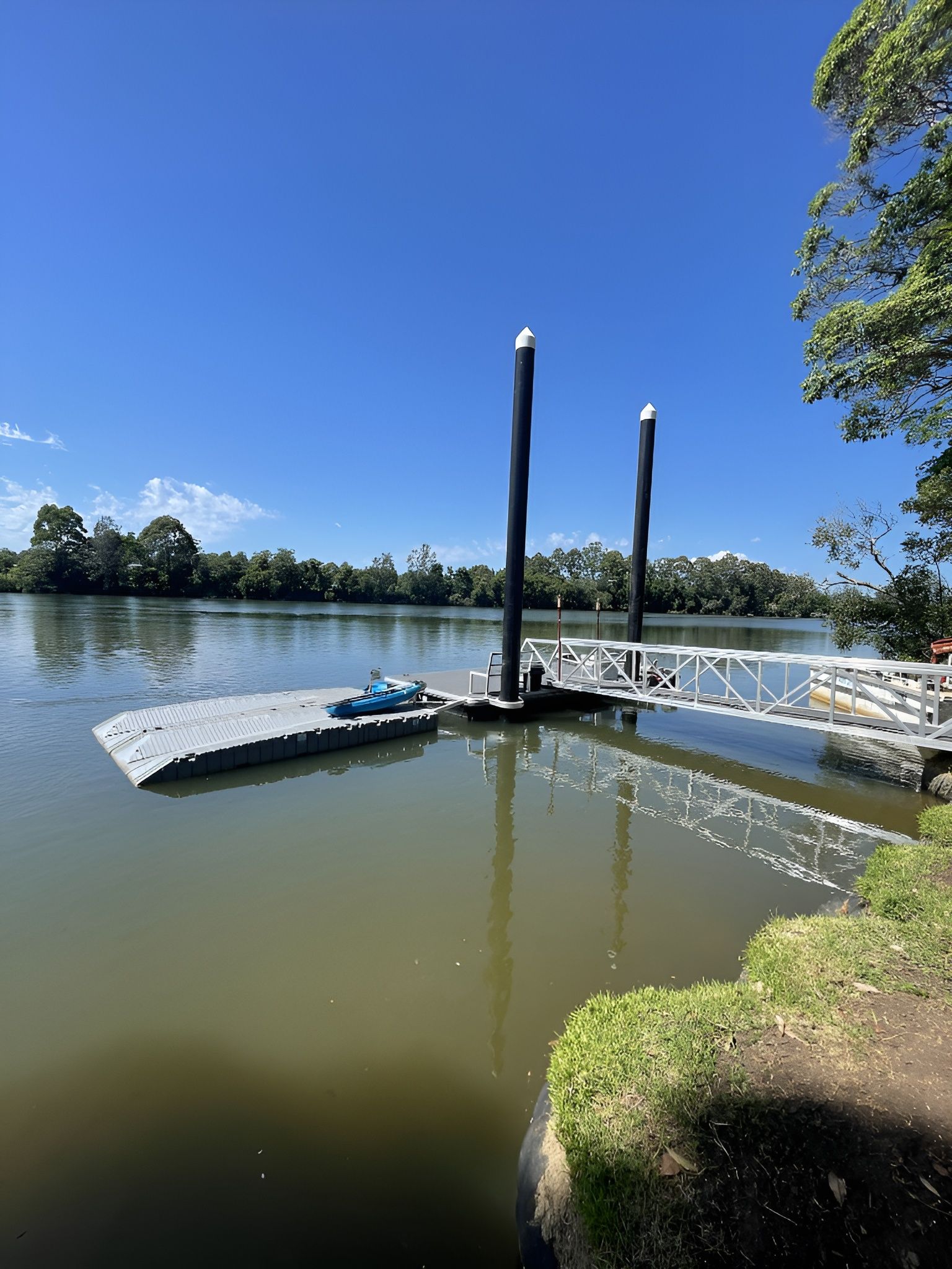 Dock on A River with A Blue Kayak — M&J Marine Services in Forster, NSW
