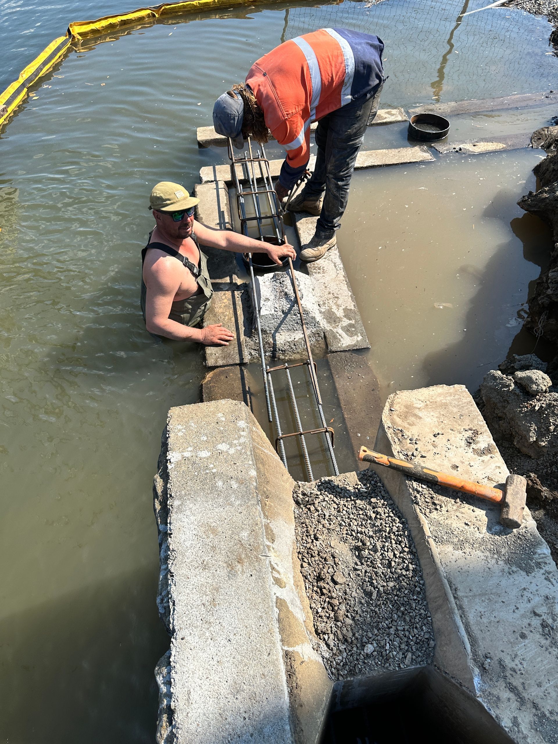 Two People Work on A Metal Rebar Framework — M&J Marine Services in Lake Macquarie, NSW