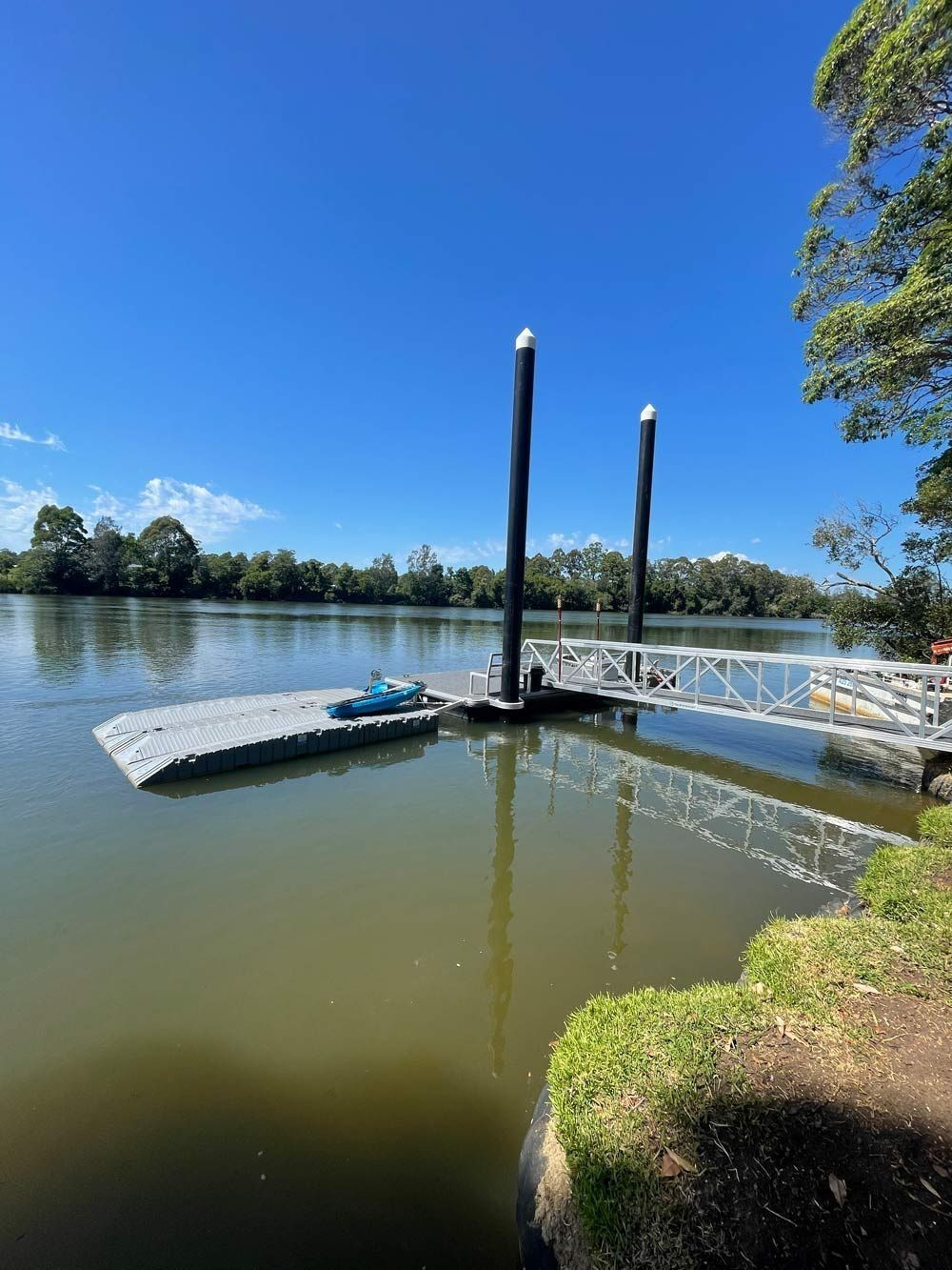 Dock on A River with A Blue Kayak — M&J Marine Services in Medowie, NSW