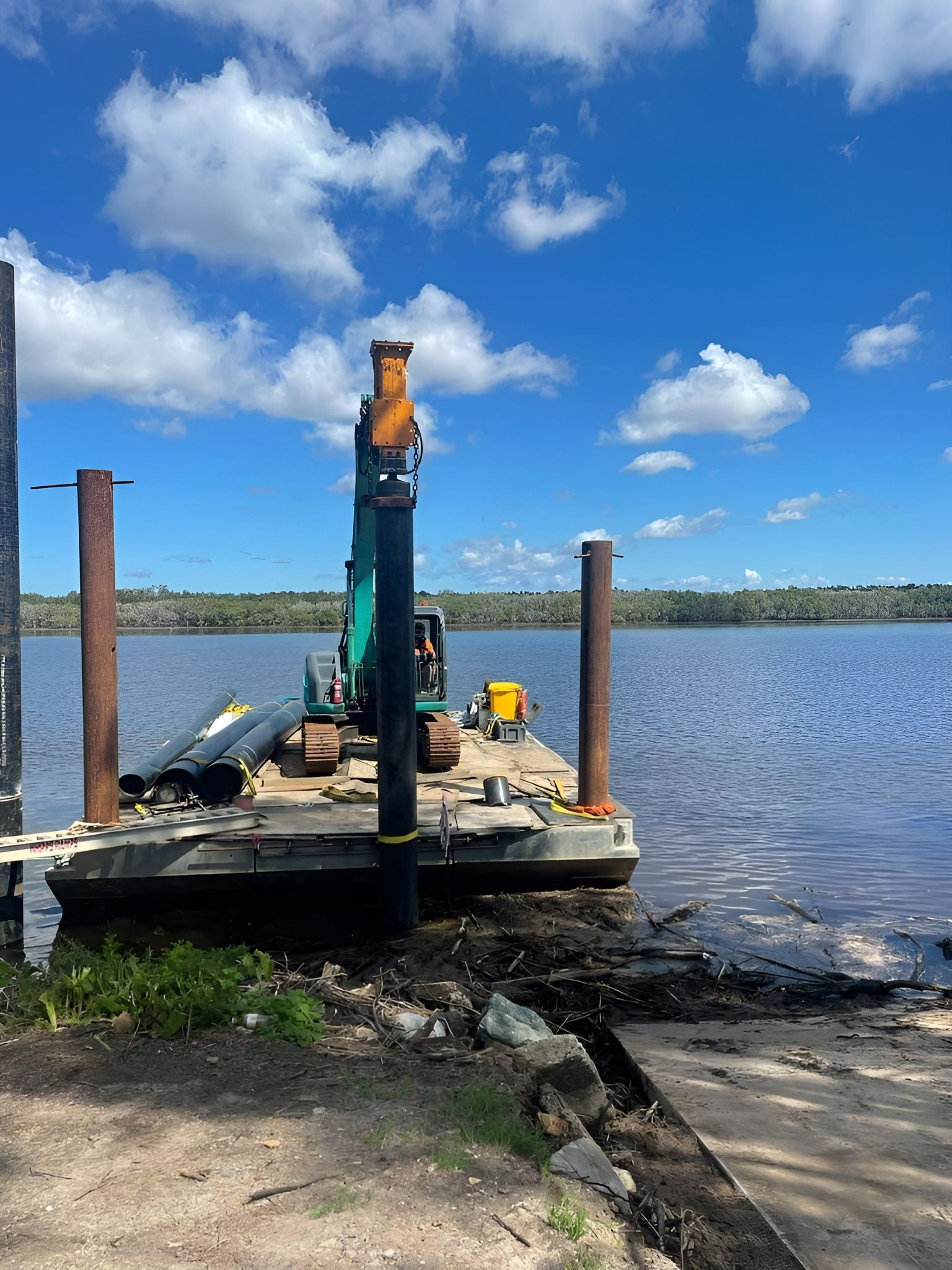 A Construction Site on A Lake and An Excavator and Equipment on A Floating Barge — M&J Marine Services in Coffs Harbour, NSW