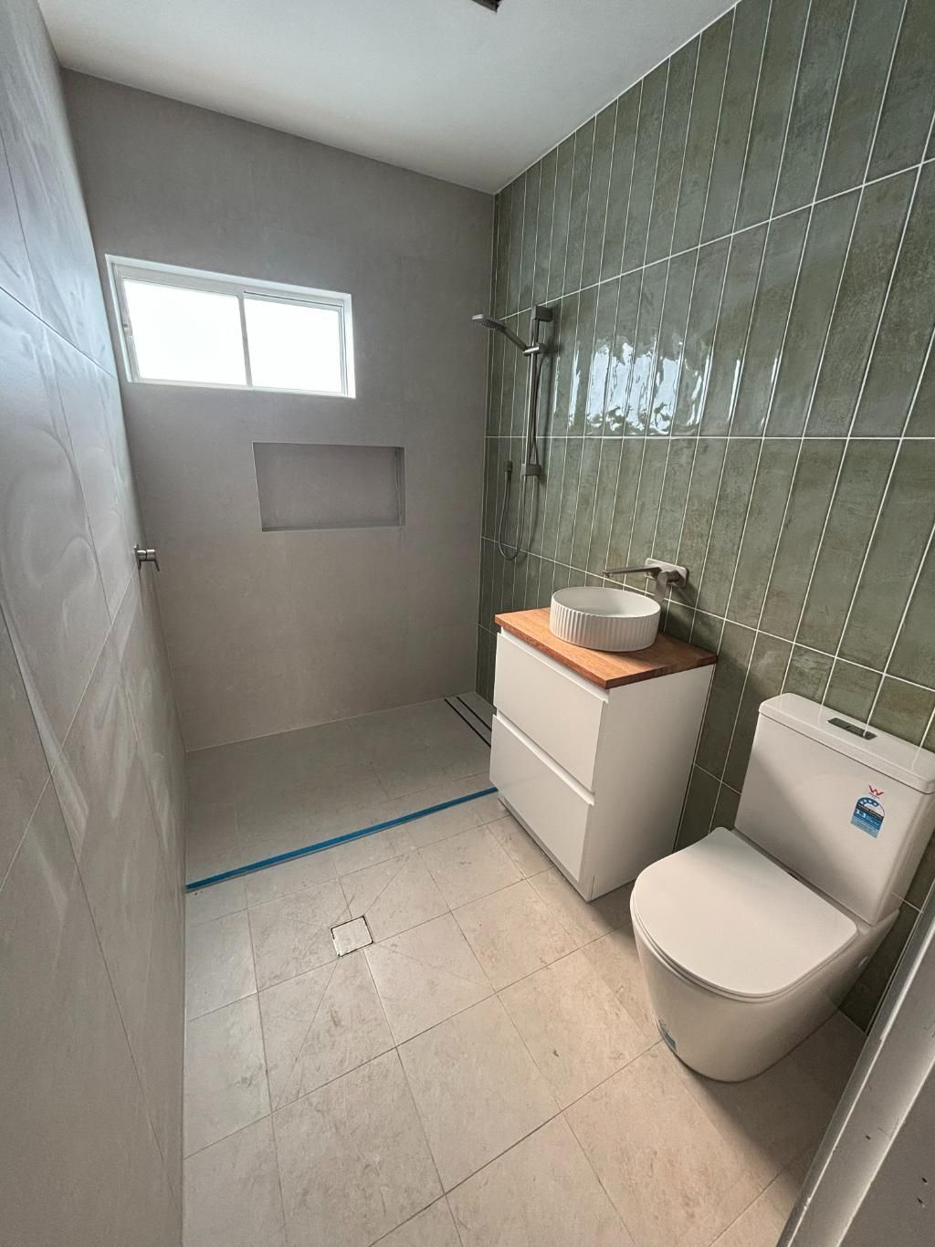 A Bathroom With A Toilet, Sink And Shower — Oceanforce Plumbing In Blacksmiths, NSW