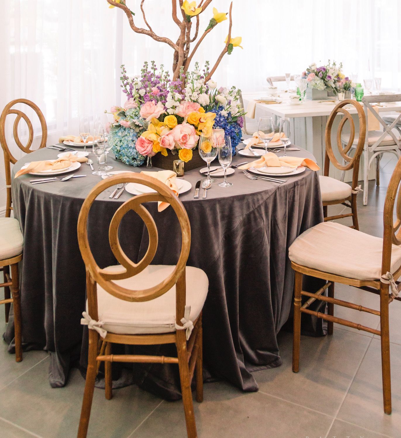 A table set for a party with flowers on it