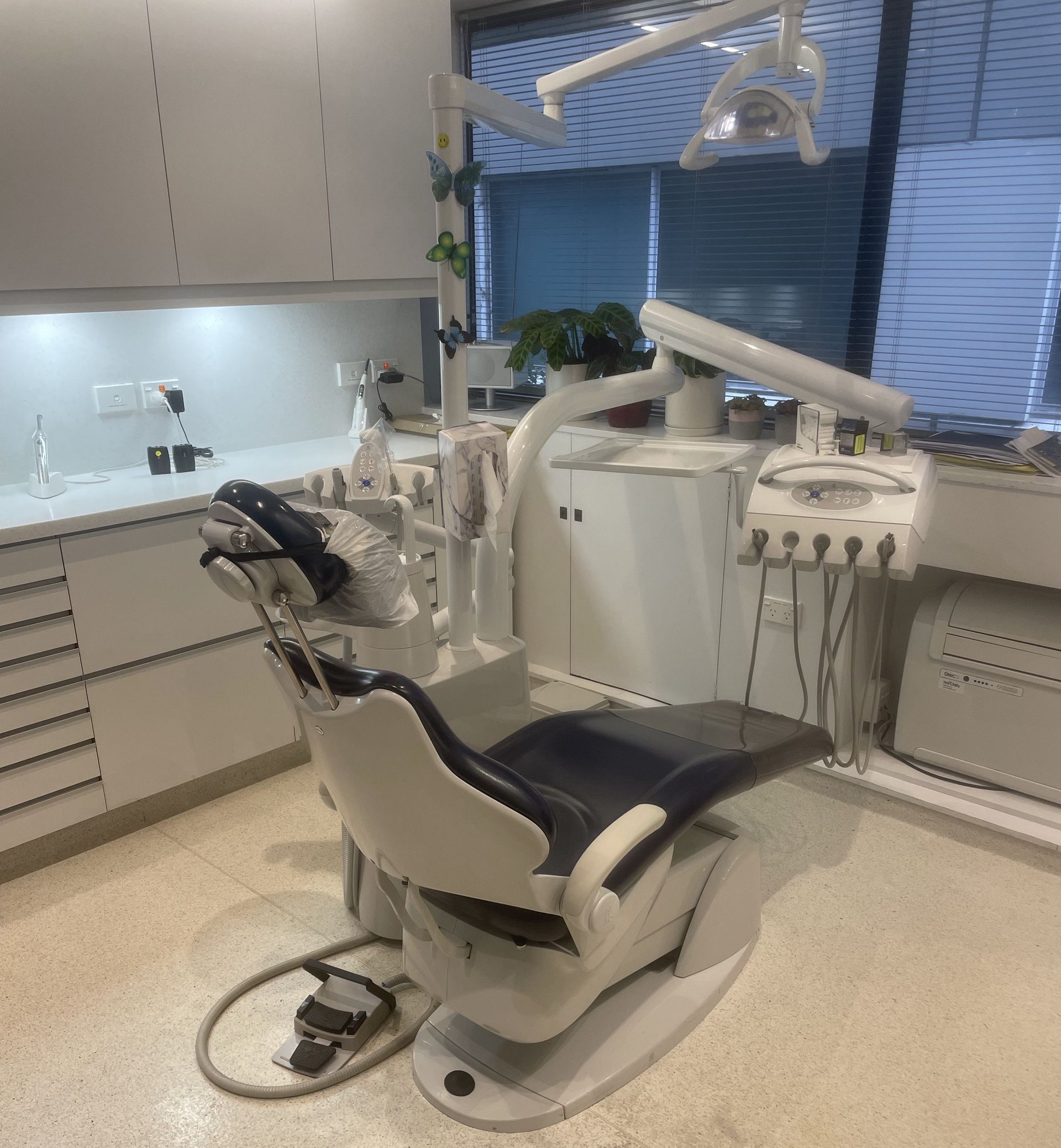 A dental office with a dental chair in it