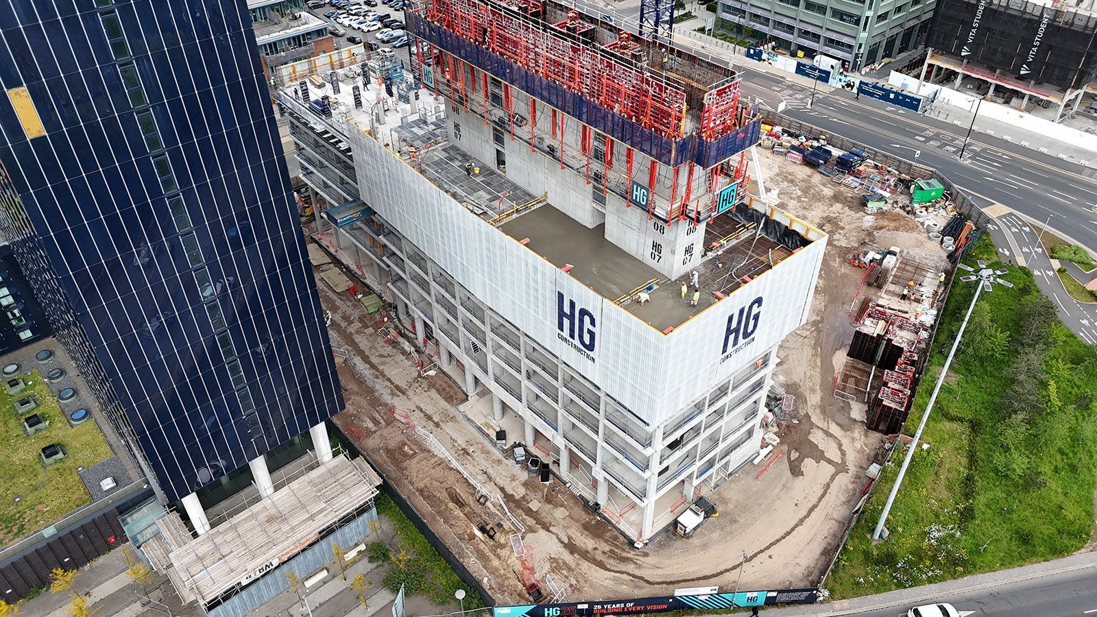 Aerial view of HG Construction hoardings on building