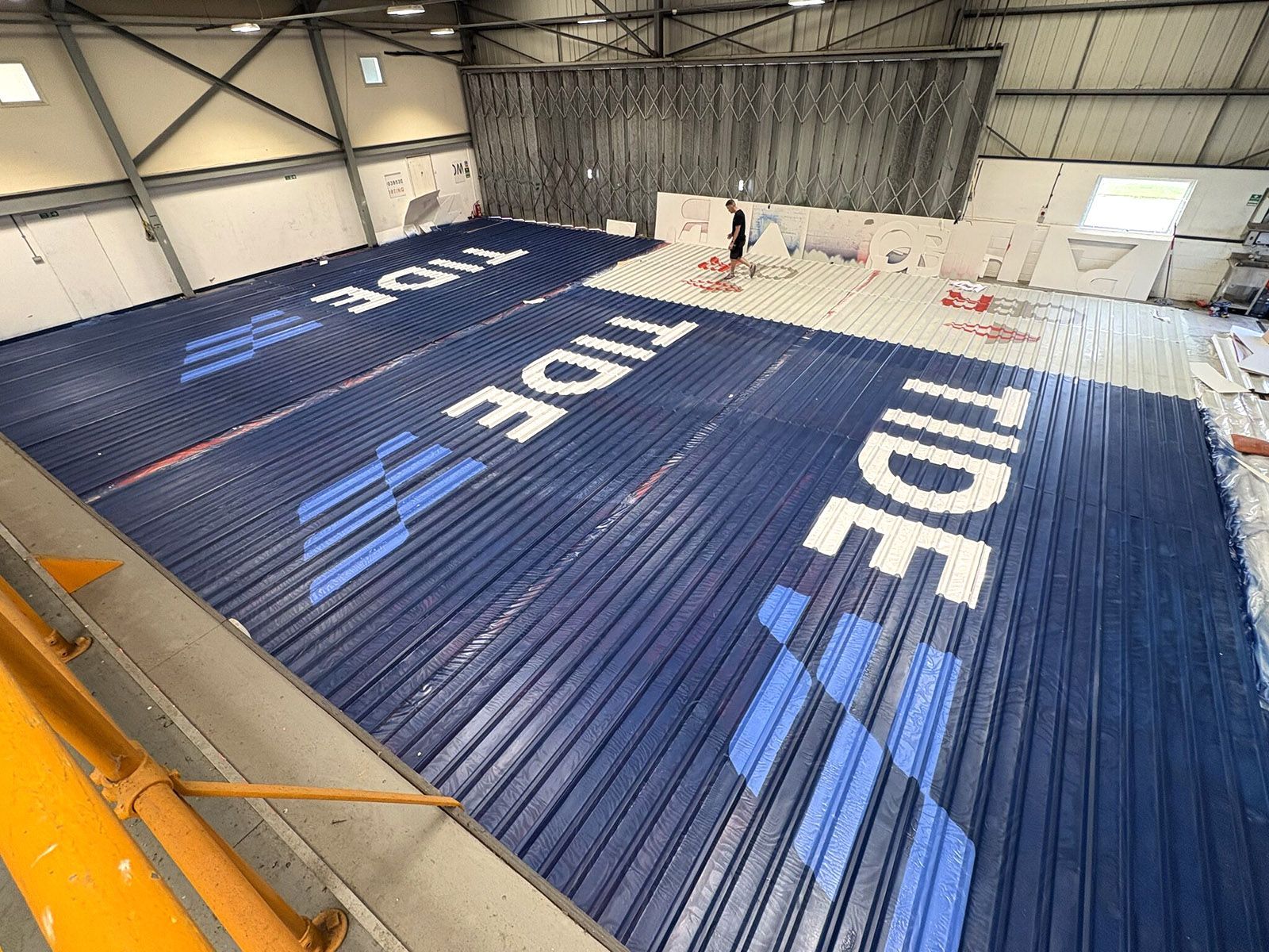 The Large Letter Company – Tide logos being painted