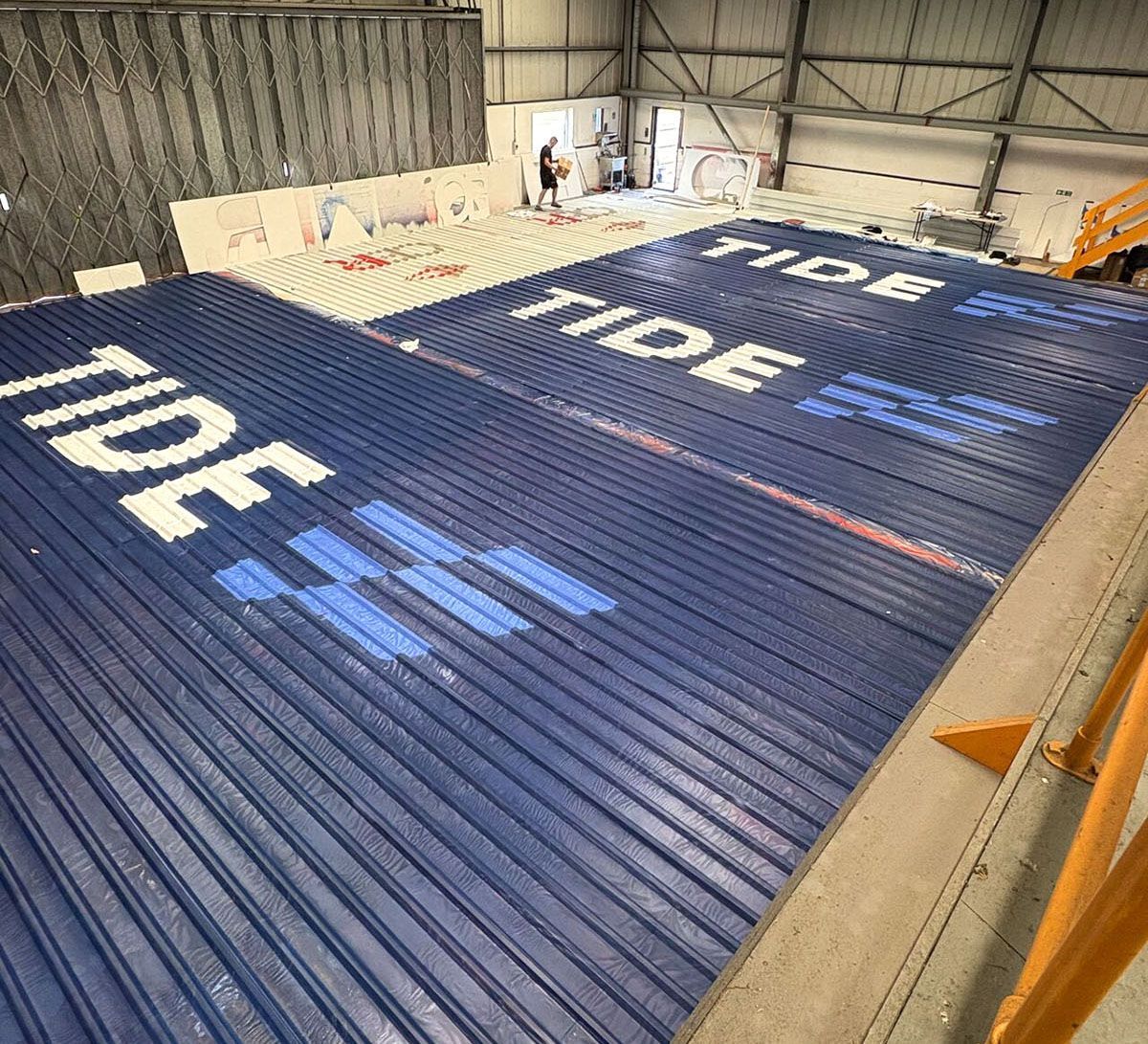 The Large Letter Company – Tide logos being painted 2