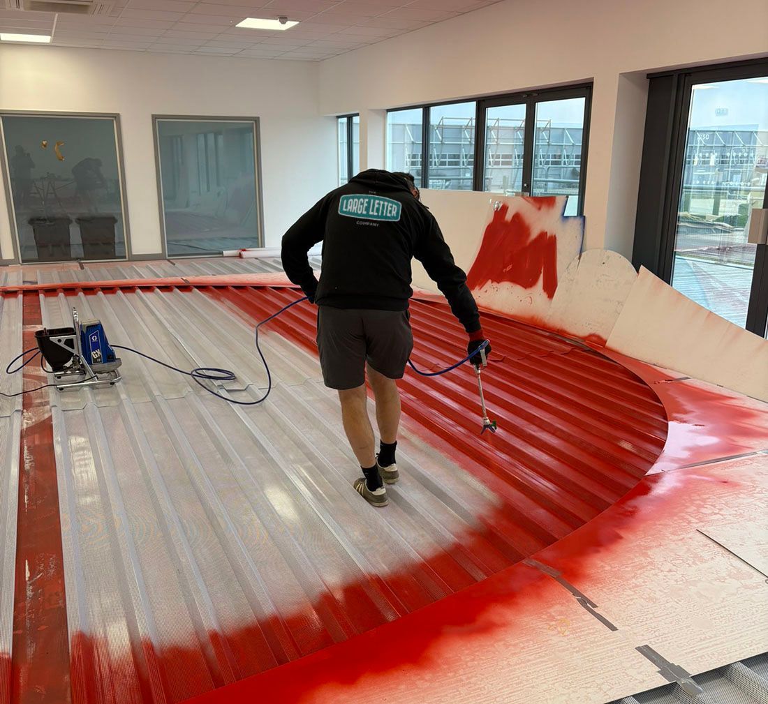 The Large Letter Company - Sisk large logo being spray painted