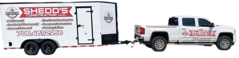 A white truck with a trailer attached to it.