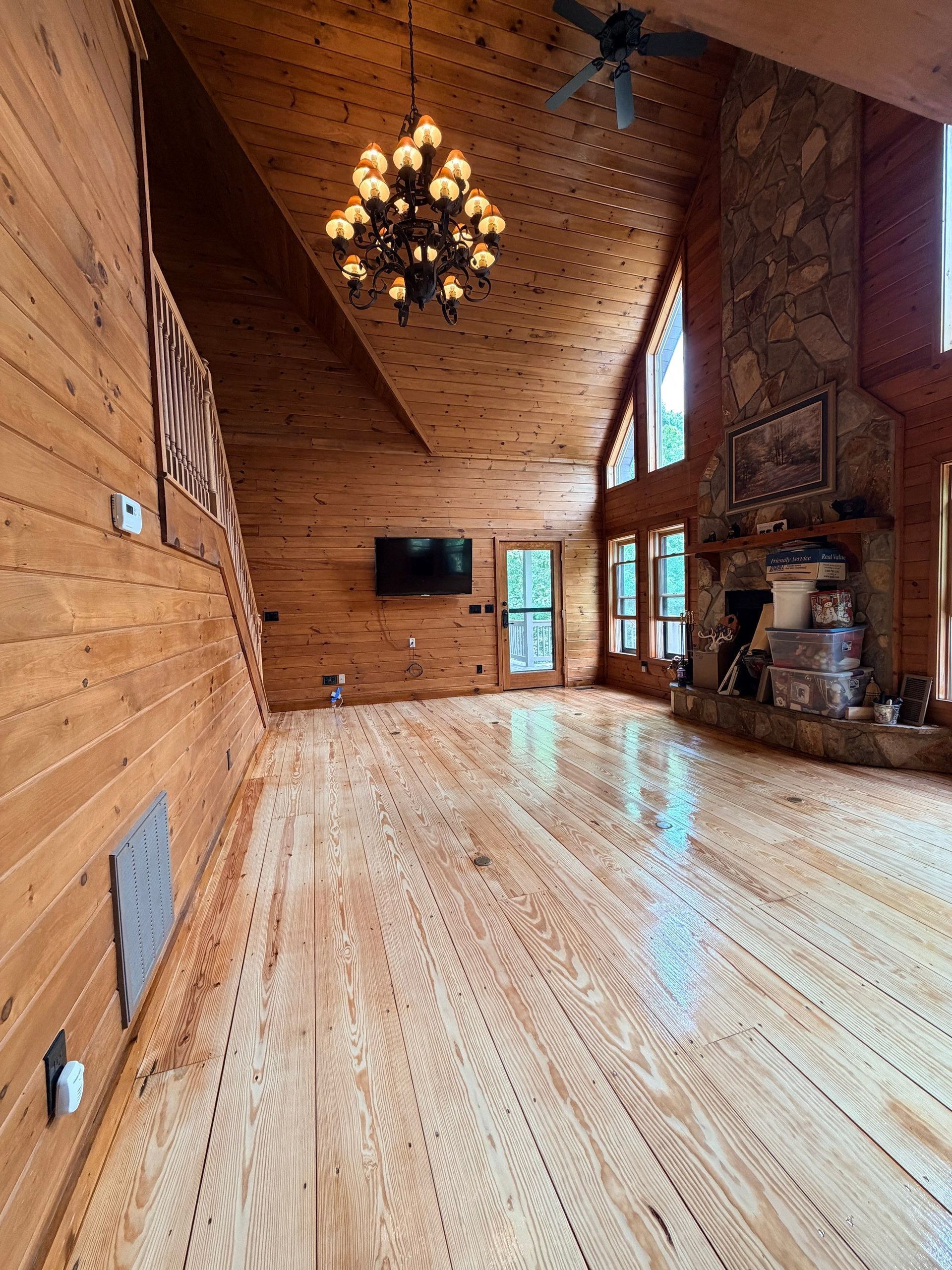 A kitchen with a tiled floor and a sliding glass door