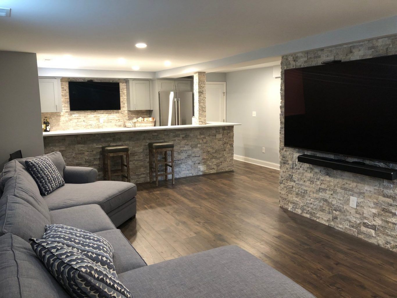 A living room with a couch and a flat screen tv