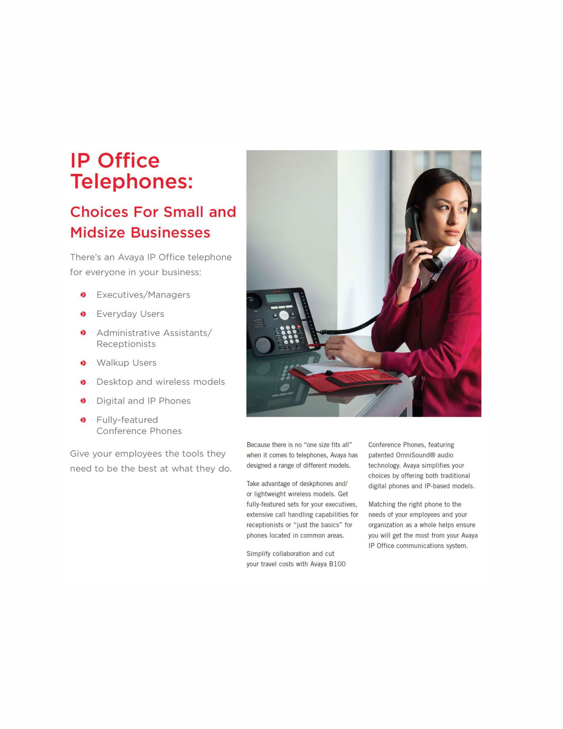 A woman is sitting at a desk talking on a telephone.