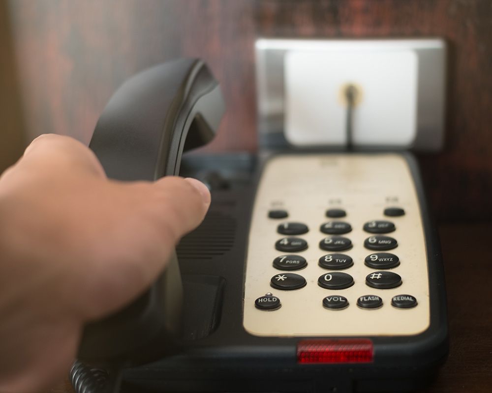 Hand holding the telephone