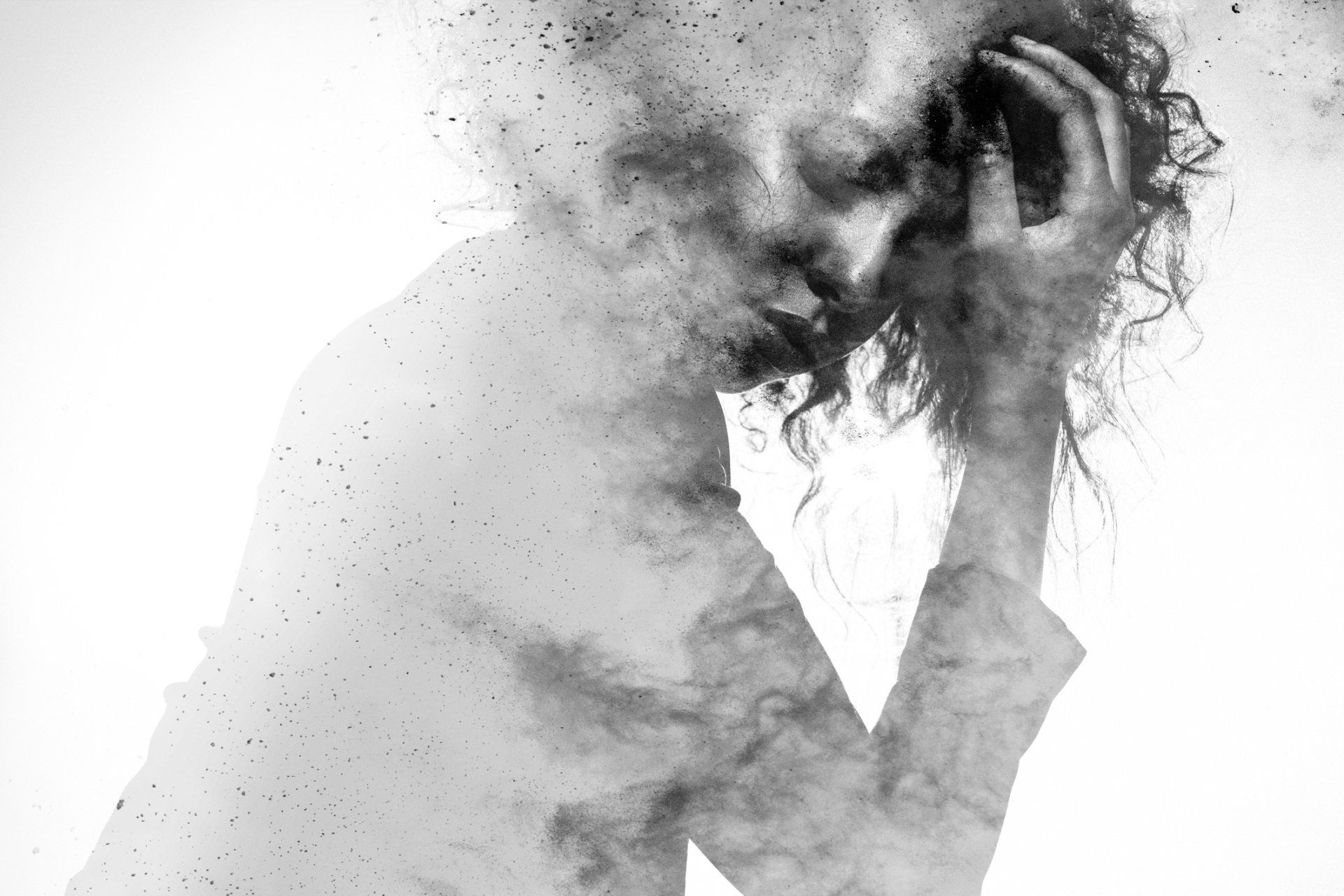 Woman with hand on head