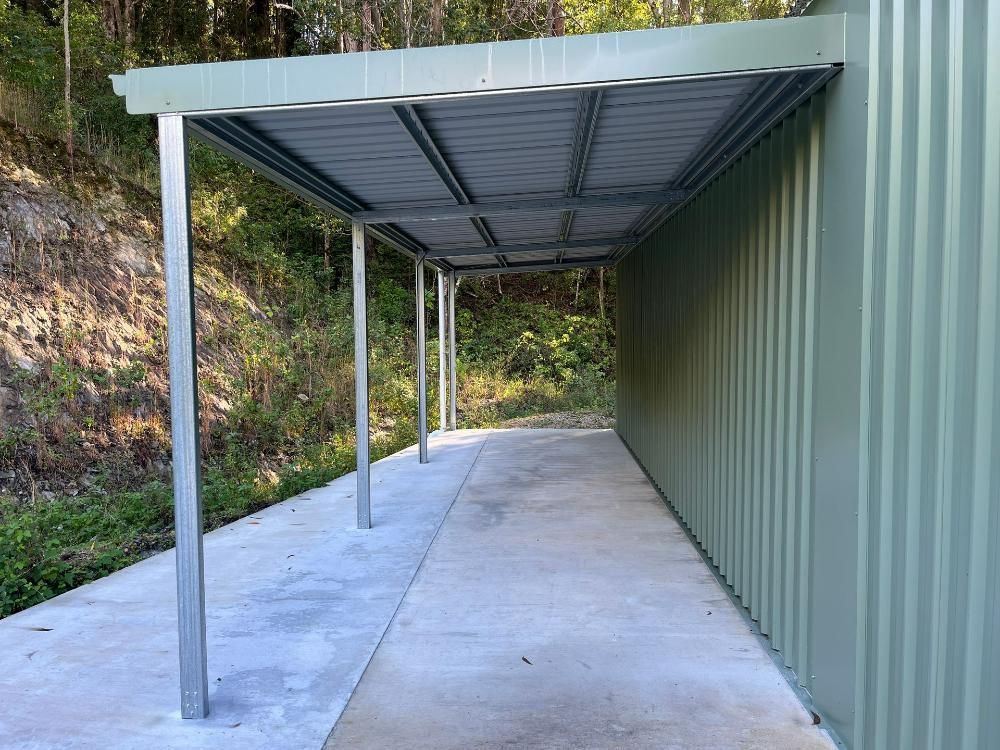 Patio With Wooden Furniture — Urbon Sheds in Uki, NSW