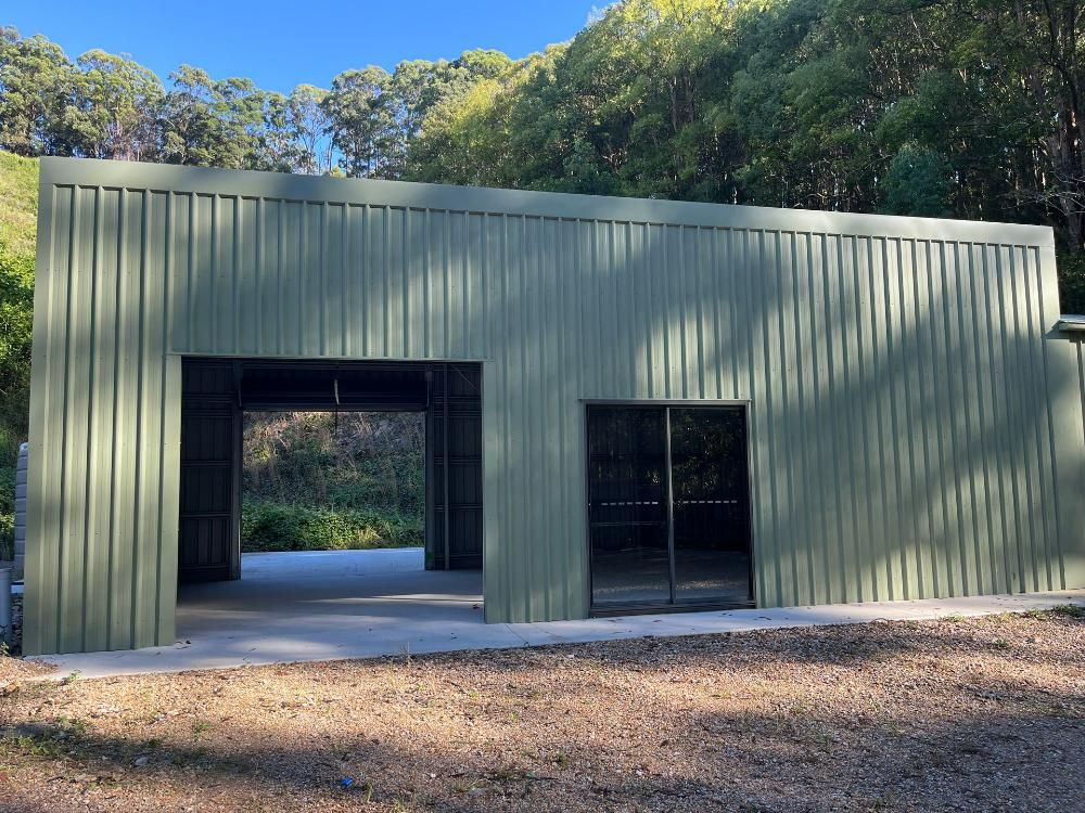 Agricultural Tractor Shed With Green Metal Roof and Green Metal — Urbon Sheds in Uki, NSW