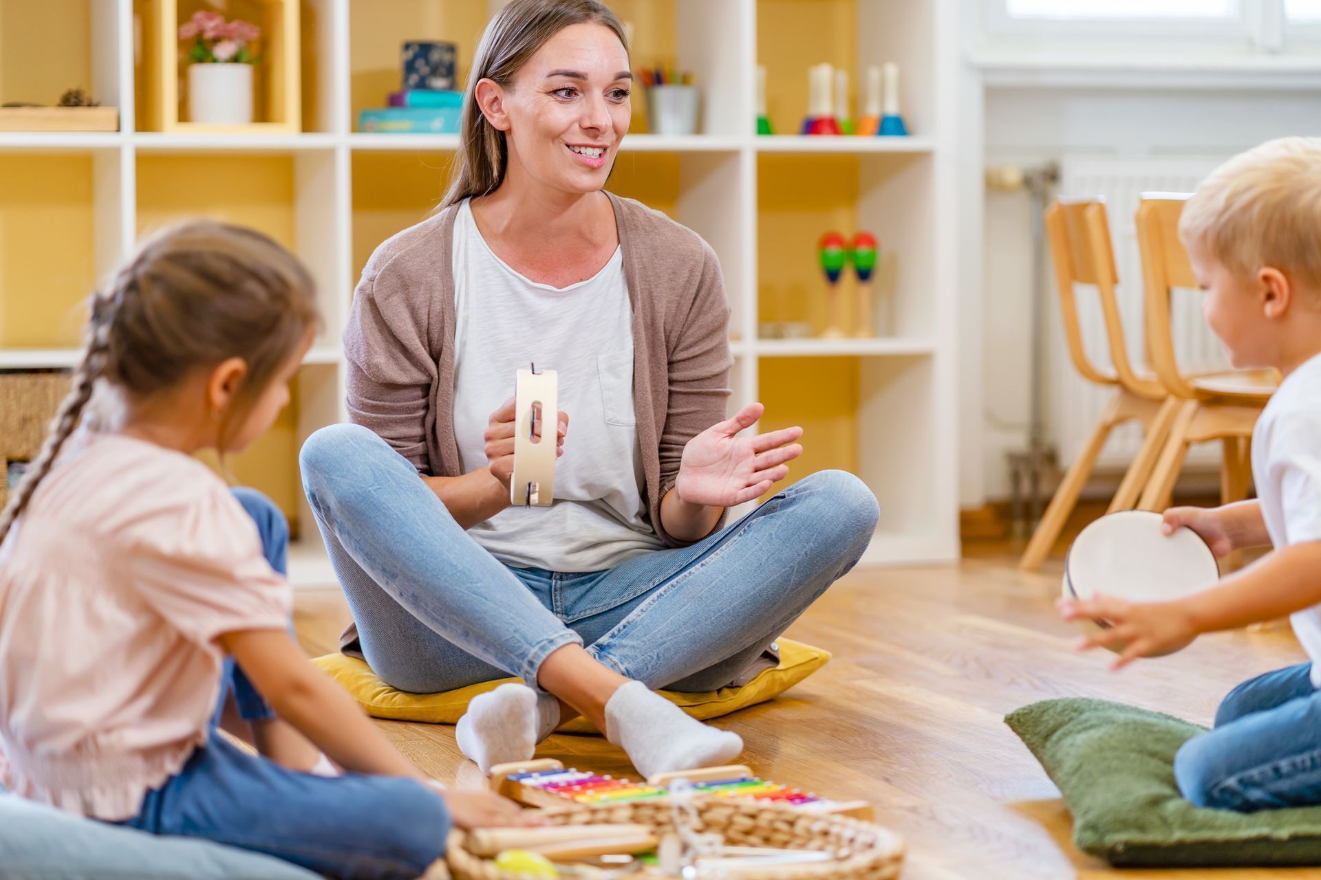 Engaging preschool program in High Naperville, IL, with kids playing music in a classroom setting.