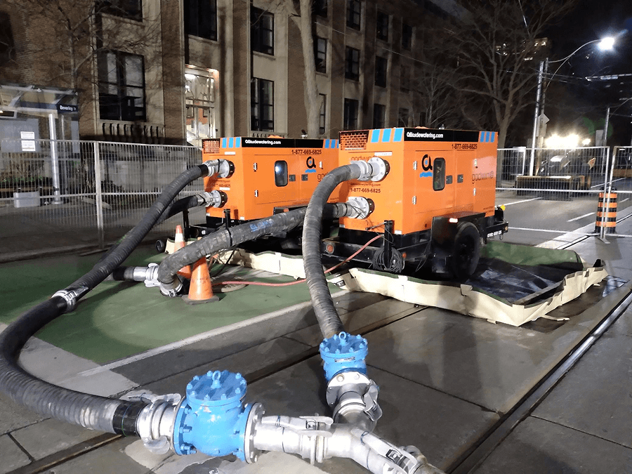 Blue industrial water treatment system outdoors with tanks and processing units.