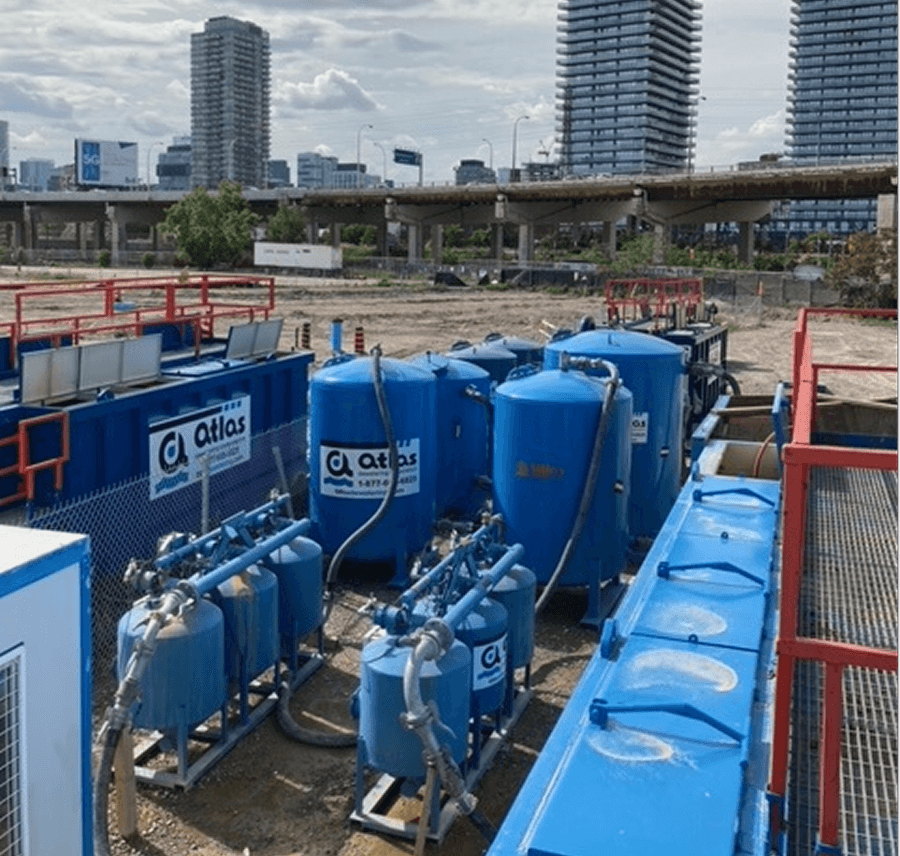 Blue container and orange generator in front of The Westin Harbour Castle hotel.