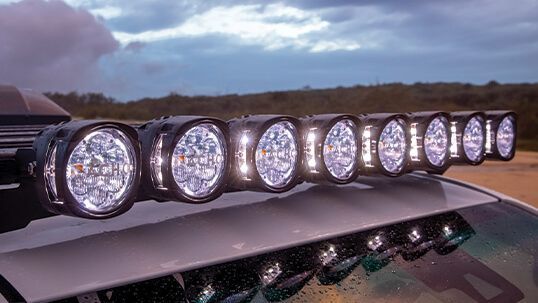 Mechanic Works on the Underside of a Vehicle, in a Shop — Stay on Track 4X4 Accessories in Gladstone Central, QLD