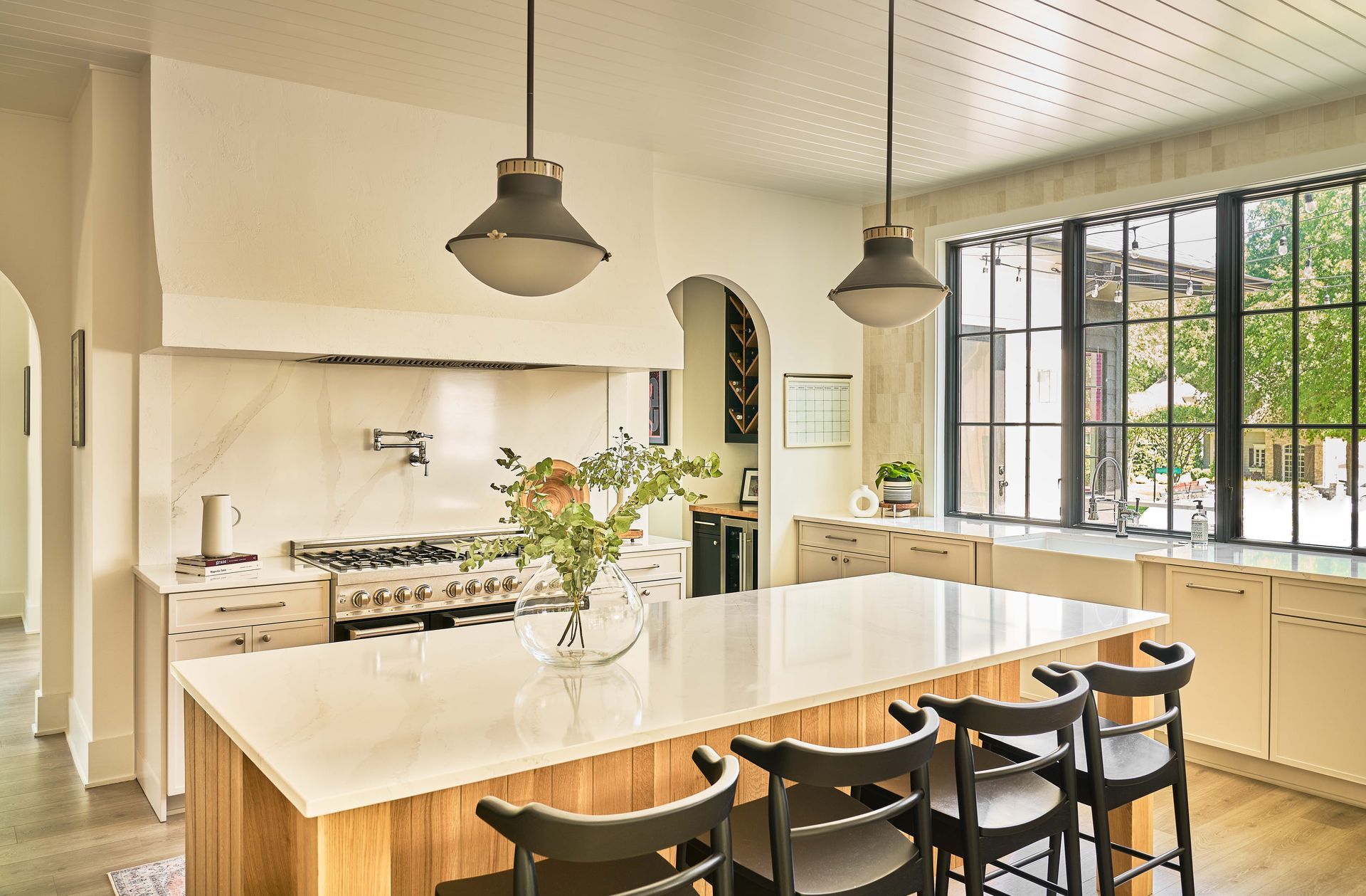 There is a large island in the middle of the kitchen.
