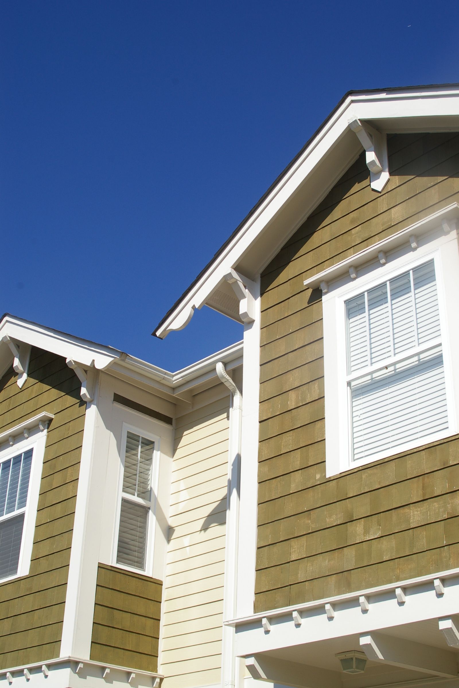 A house with a blue sky in the background