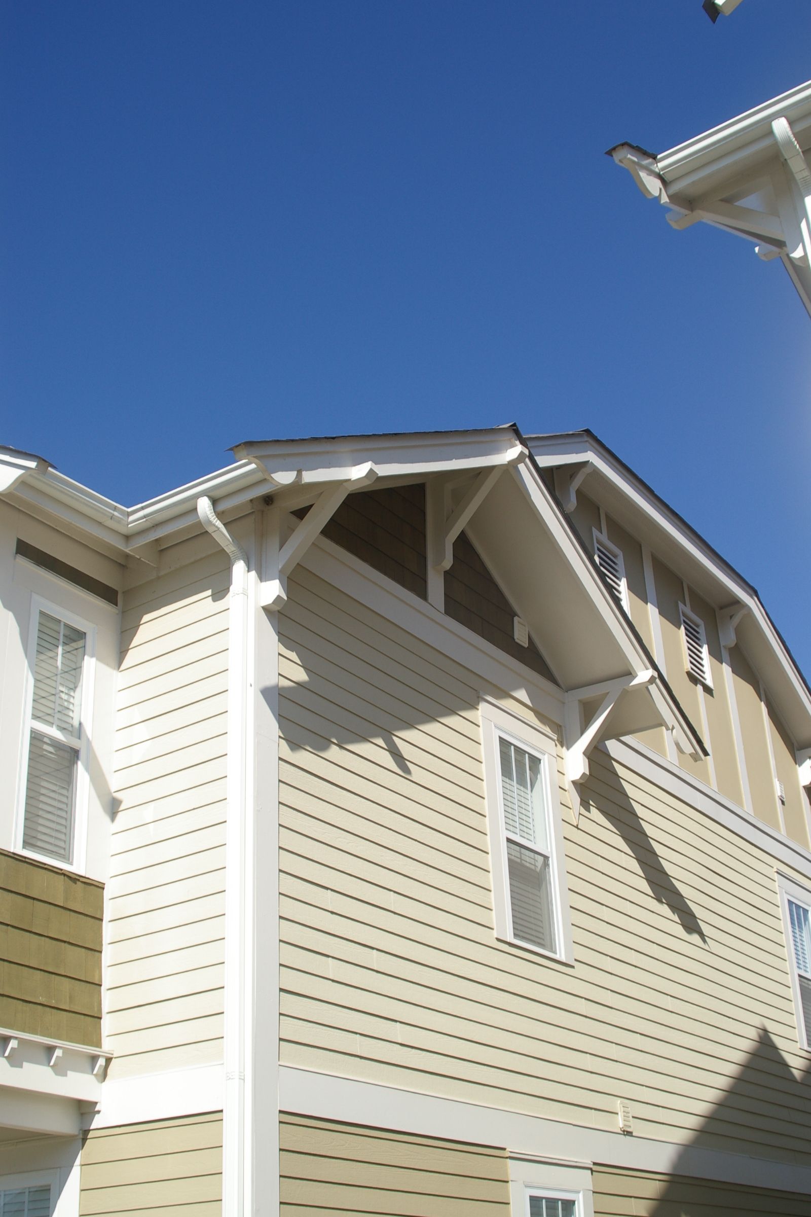 A house with a blue sky in the background