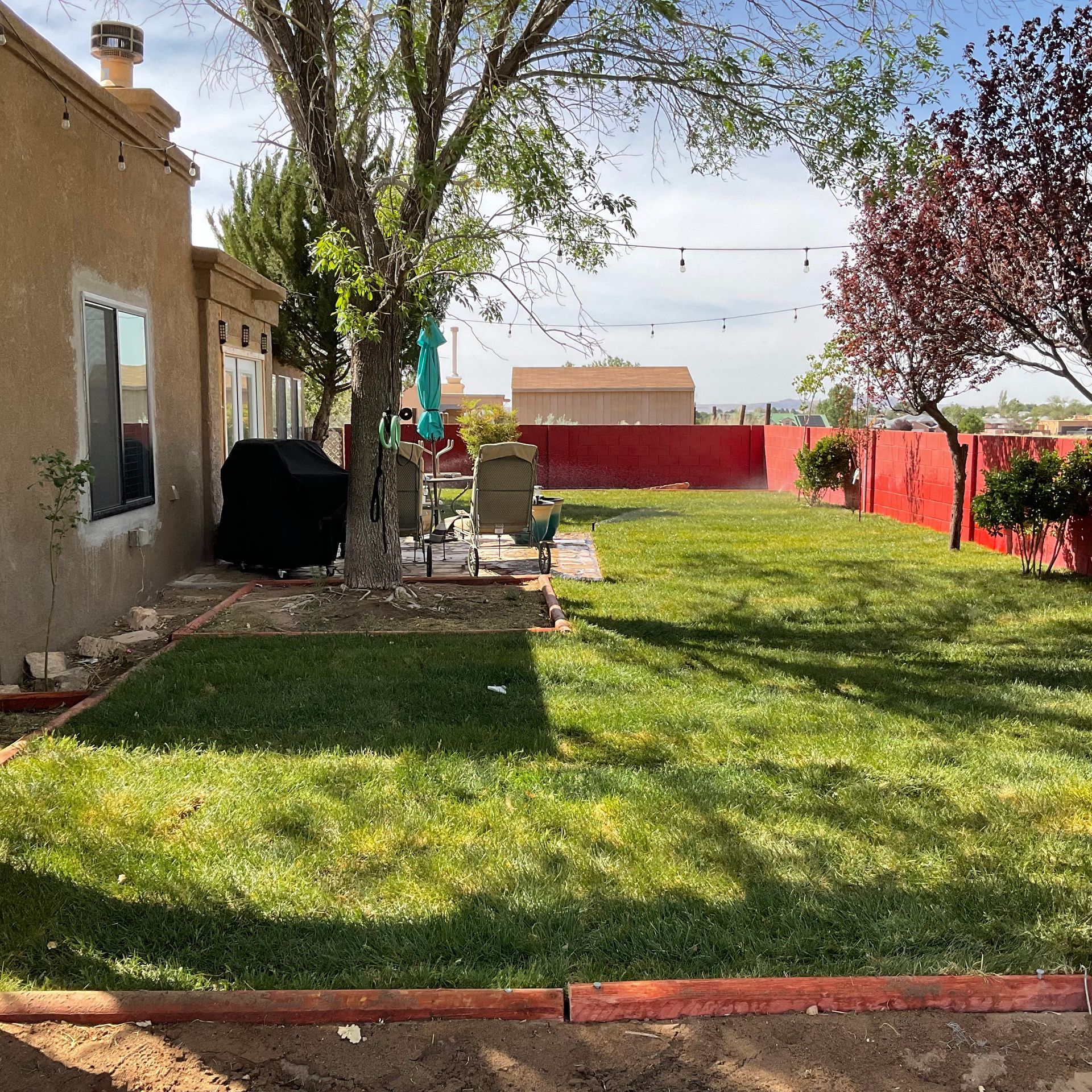 A house with a large lawn in front of it