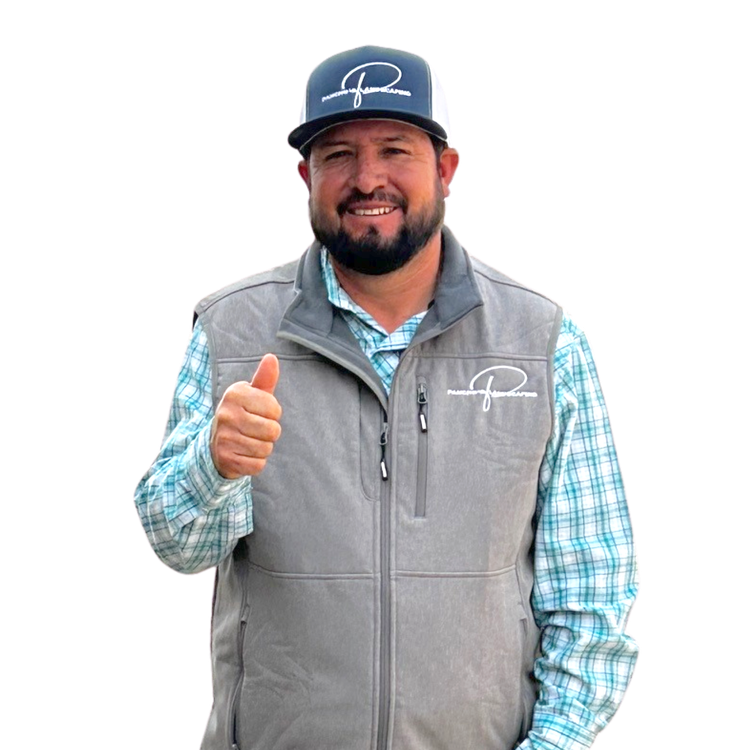 A man wearing a vest and a hat is giving a thumbs up
