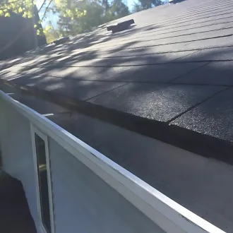 Aluminum eavestrough installation on residential roof in the Greater Toronto Area