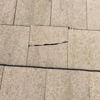 Cracked marley concrete roof tiles ready for repair and maintenance