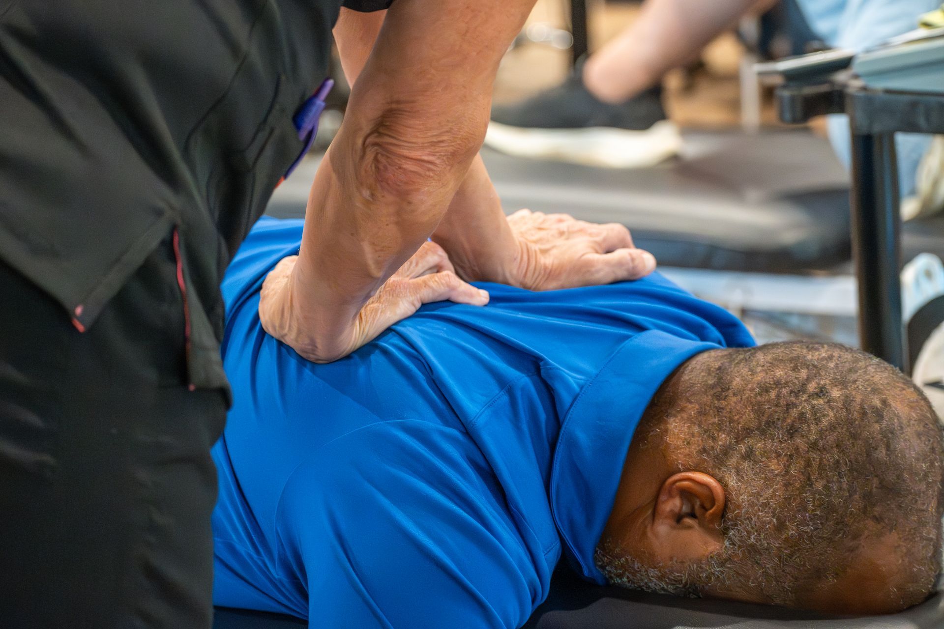 Physical therapist performing manual therapy on patient for neck pain at MOSS Rehabilitation Center in Springtown Texas