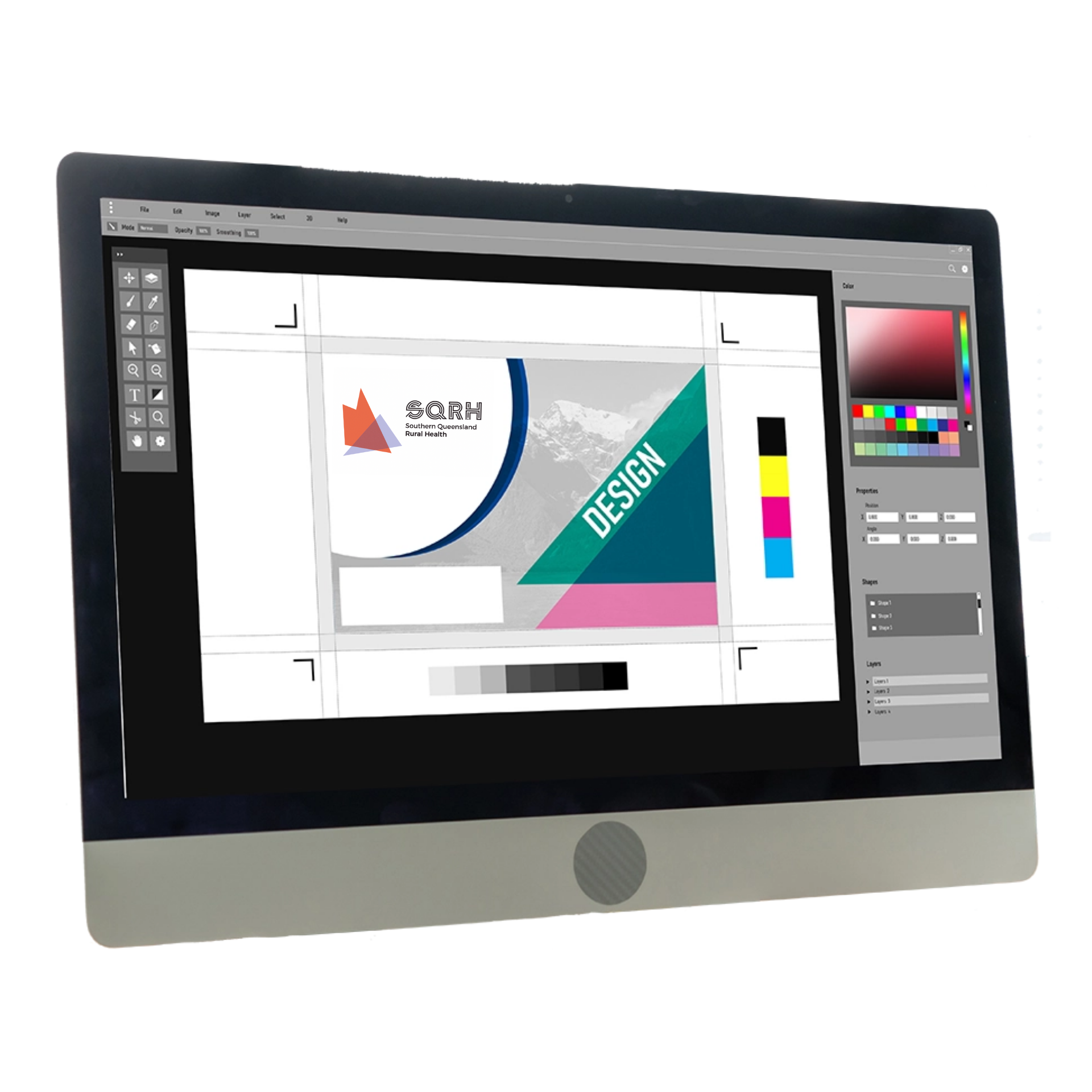 A sleek, silver desktop computer screen displaying professional graphic design software with a colorful layout project.