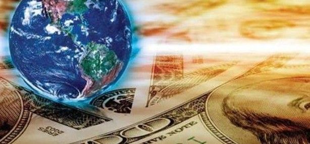 A globe is sitting on top of a dollar bill.